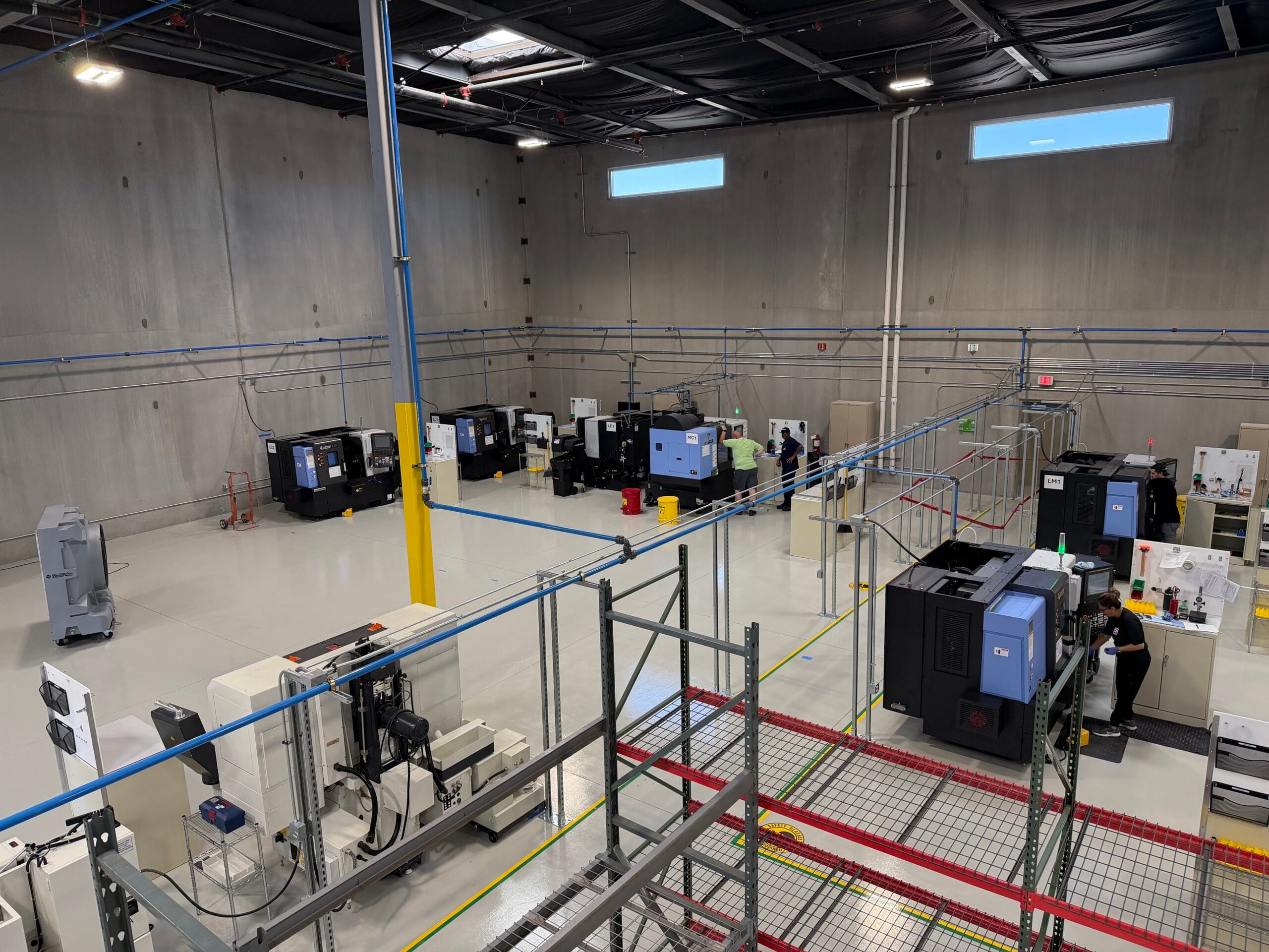 Industrial warehouse space with electrical equipment control panels and cabling infrastructure setup